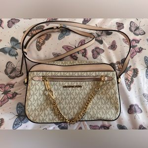 Michael Kors Jet Set CrossBody is like brand new. I get it but mistakes .